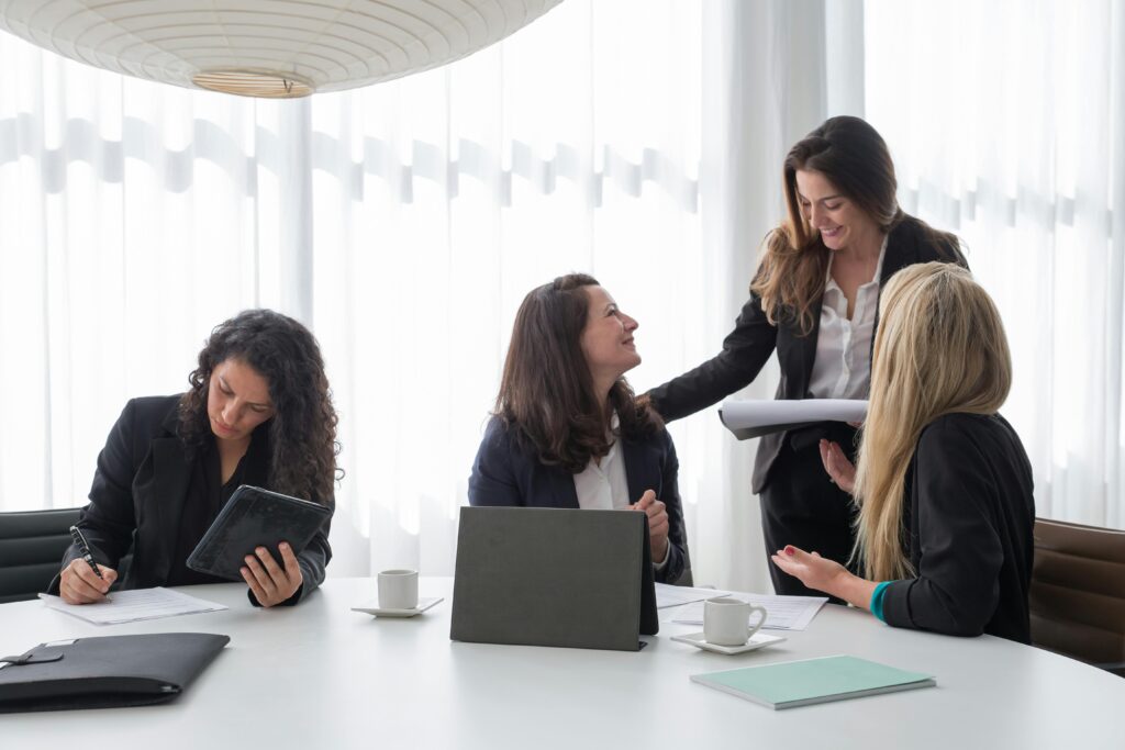 pexels photo 8171204 8171204 Business meeting with women in corporate attire engaged in discussion and planning indoors.
